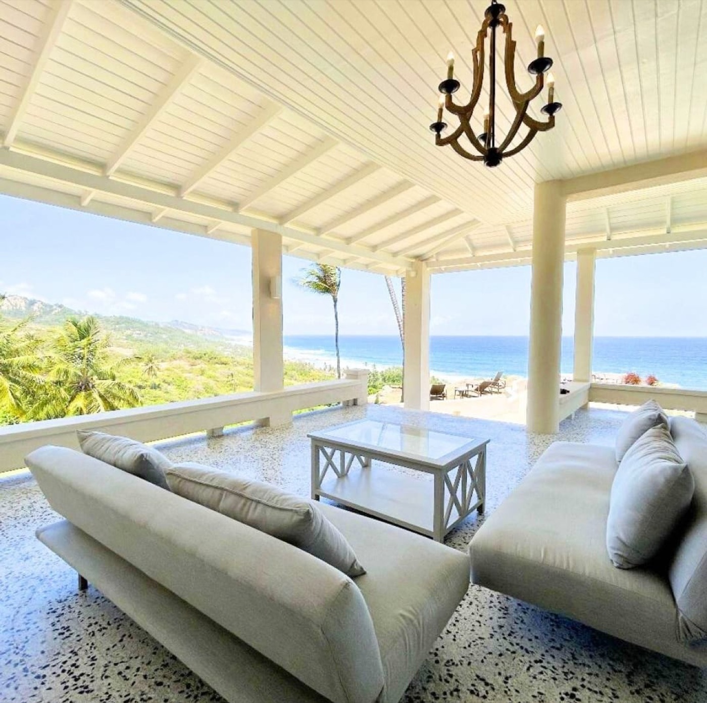 Covered veranda overlooking the garden and ocean
