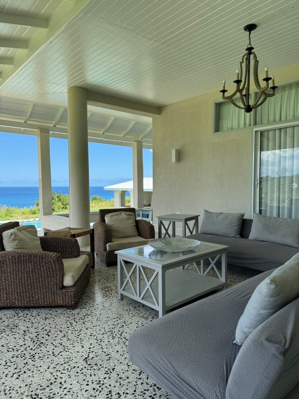 Covered lounge seating with a view toward the coast
